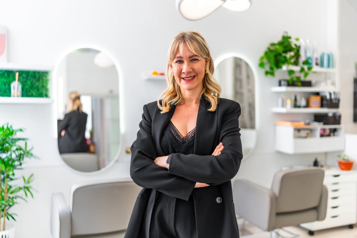 Successful hairstylist entrepreneur in her modern salon